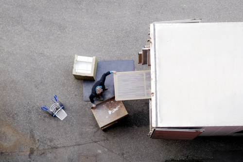 Commercial removals team transporting office equipment in West London