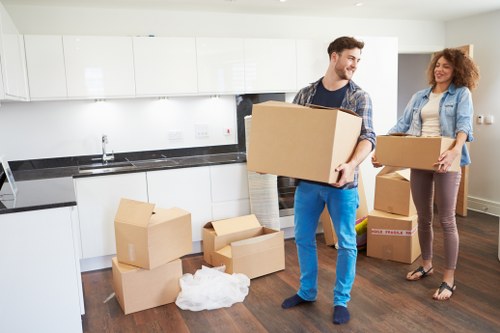 Packed moving boxes ready for a home relocation in Old Oak Common