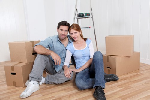 Packed boxes and furniture prepared for a moving van job in Old Oak Common
