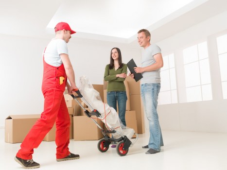 Team member assessing moving risks before lifting furniture