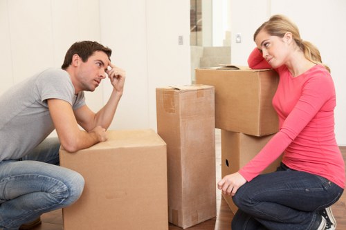 Professional movers packing household belongings for a local move