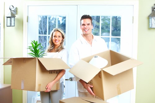 Professional movers handling boxes and furniture for a local move