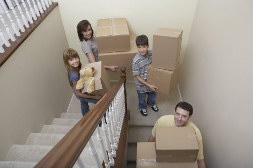 House removals team loading boxes and furniture for transport