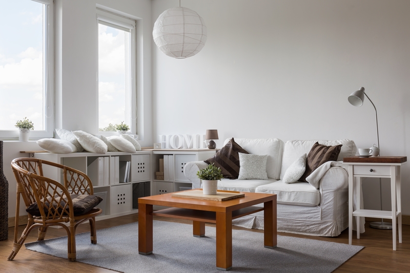 Movers handling furniture in a West London residential property